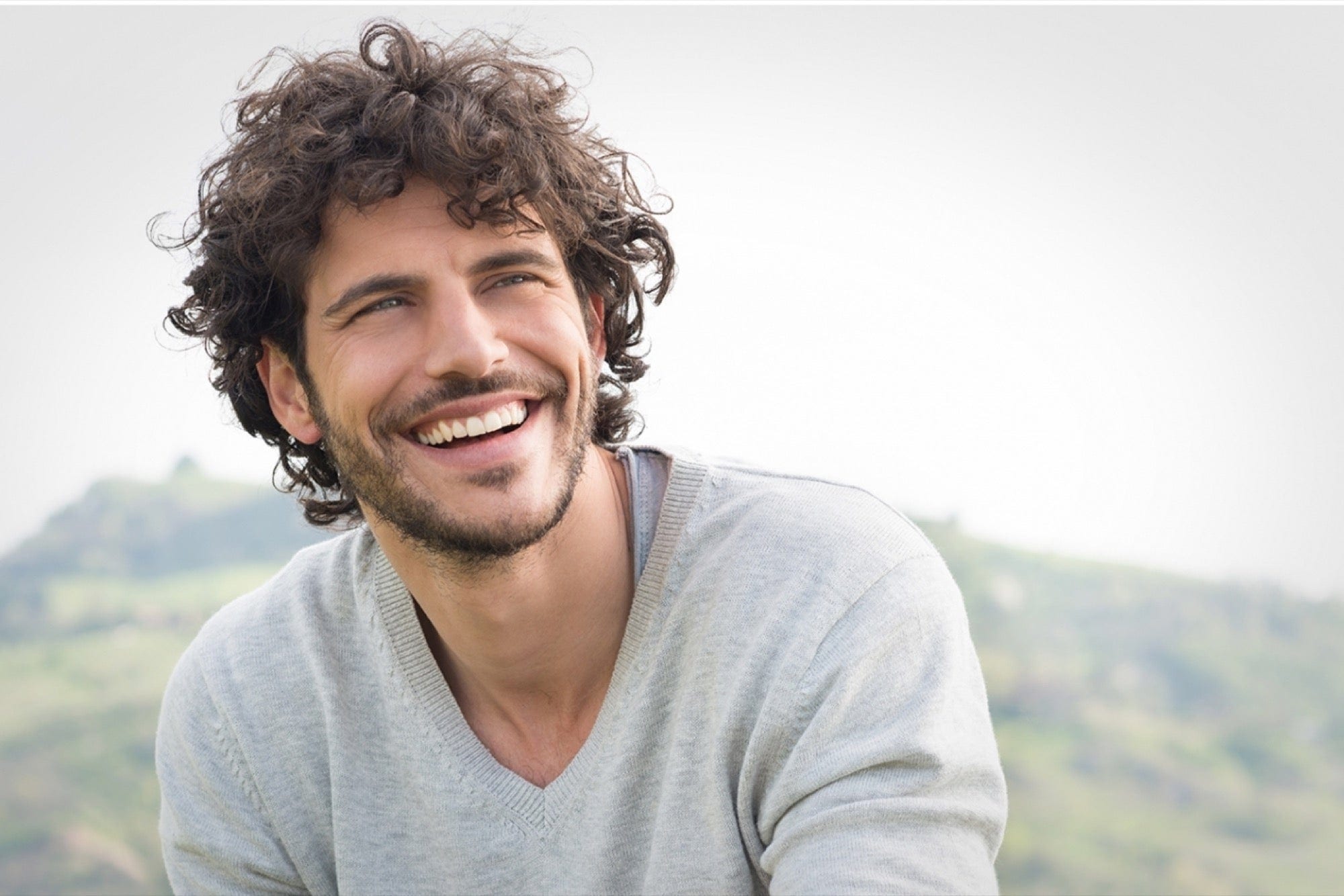 Smiling man relaxing outdoors