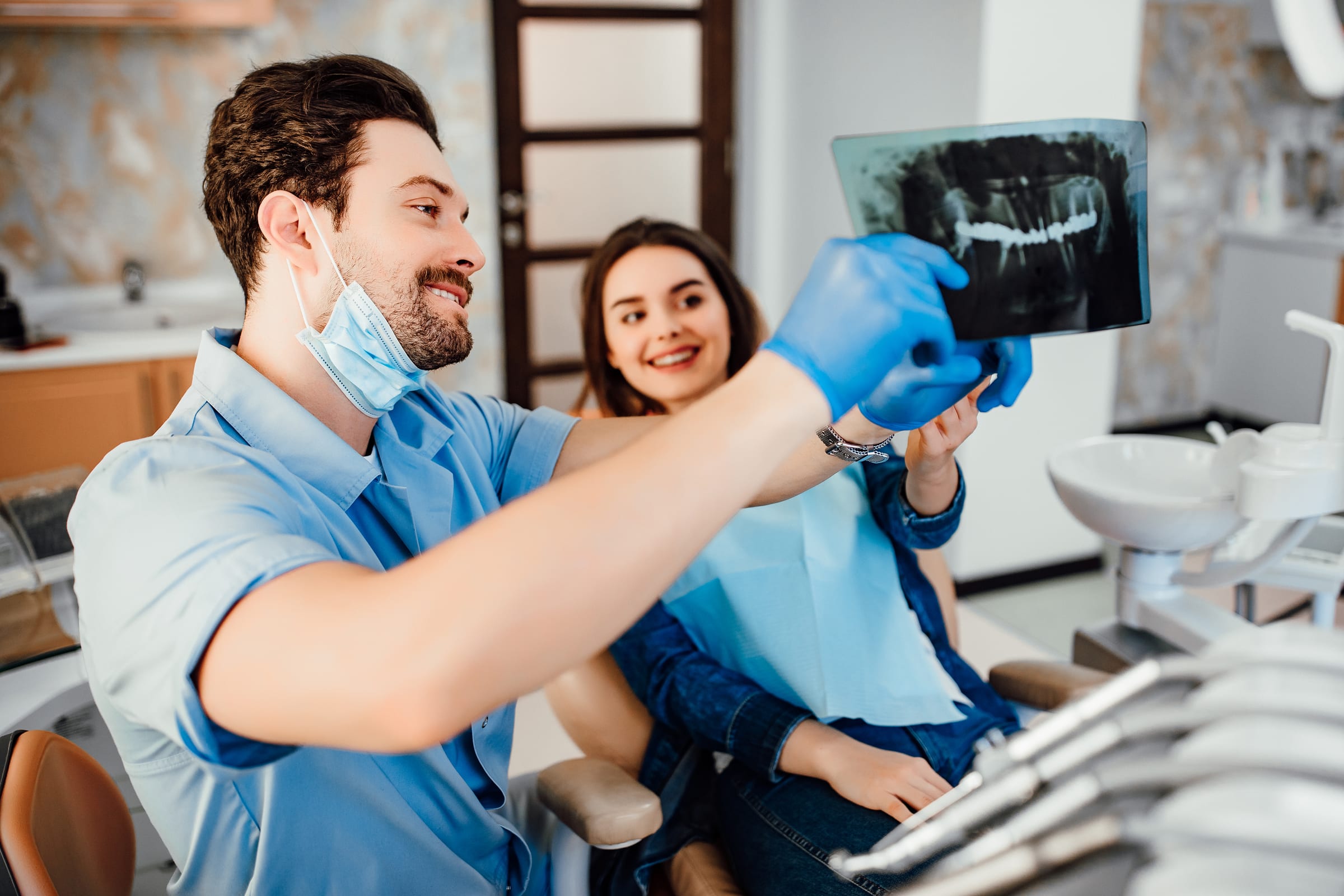 Dentist showing a patient her digital X-ray